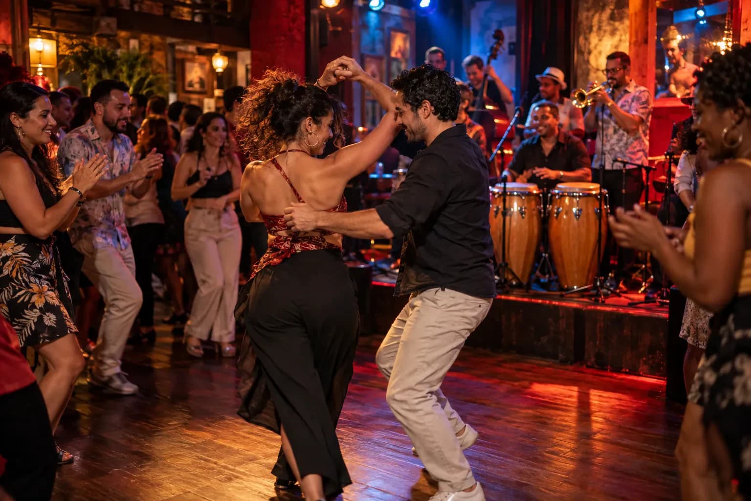 Couple dancing salsa in a bar at night